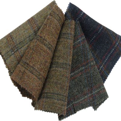 Light weight wool tweeds woven in plaid design. Browns and greens.