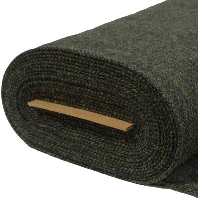 Herringbone woollen tweed fabric woven with Turf warp and Green bushes weft. Mid weight fabric.