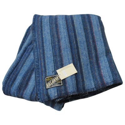 Generous sized double bed wool blanket. Subtle design with blue and navy stripes with reds, yellows and greens